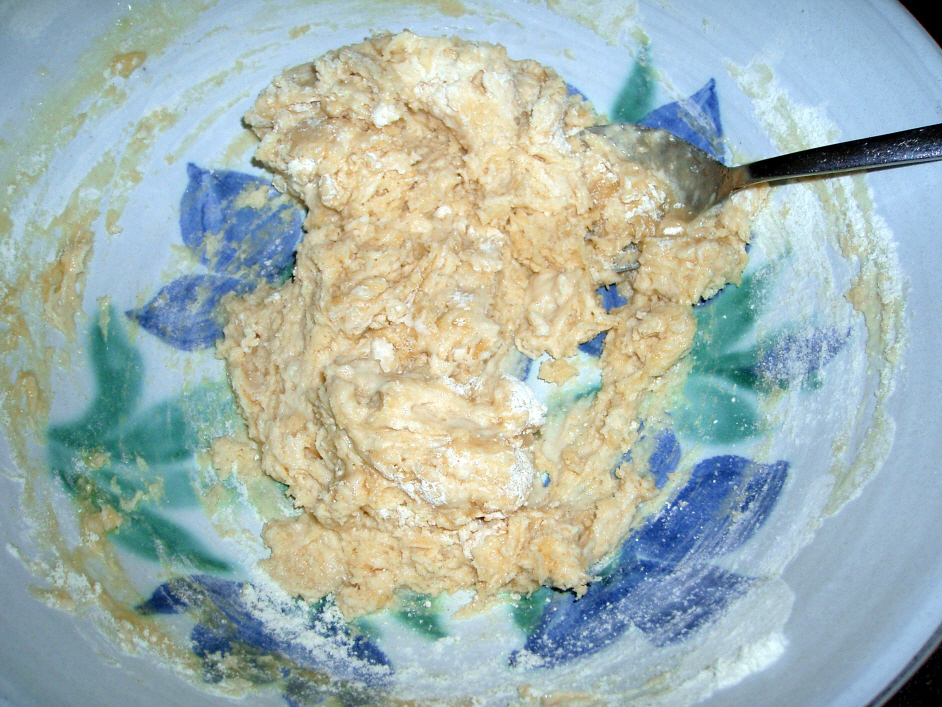 pastry made with oil, in a bowl, with a spoon