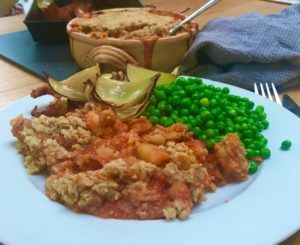 close up of chickpea crumble, on a plate, with sides