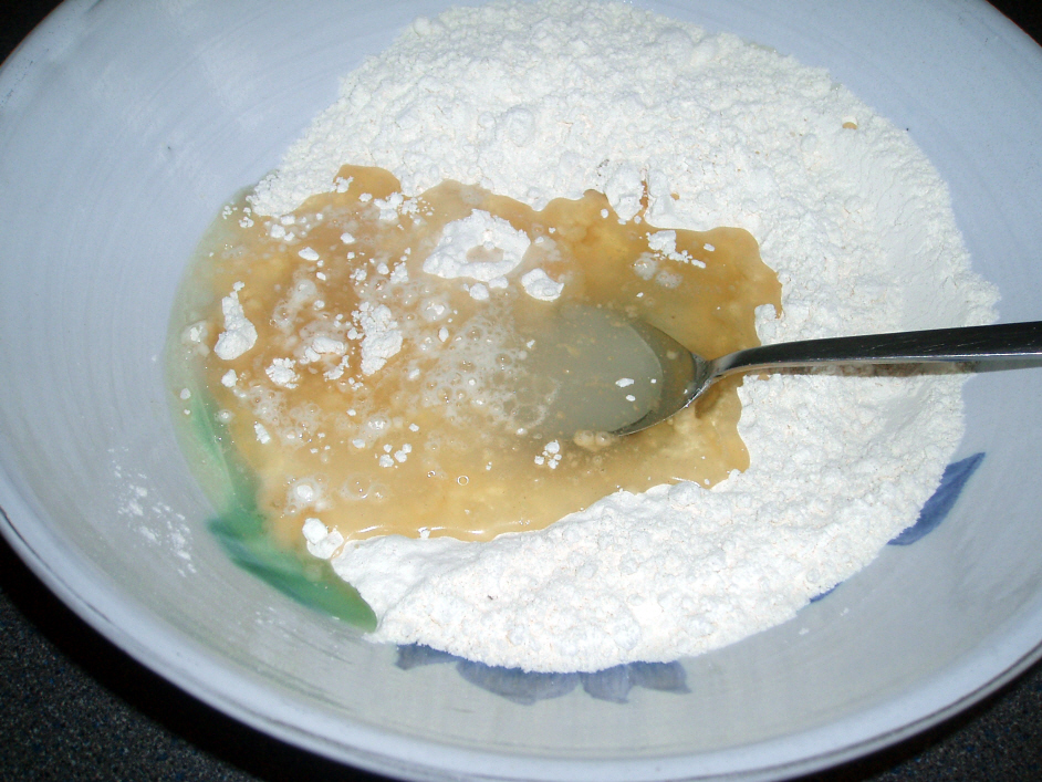 flour oil and water in a bowl to make oil pastry