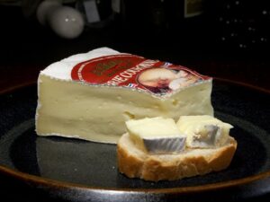 a piece of Brie on a plate