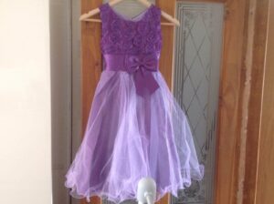 a purple childs bridesmaids dress