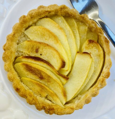 an individual French apple tart