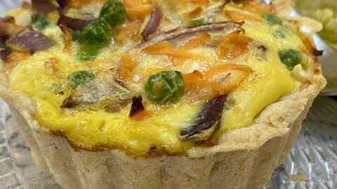 an individual mixed vegetable quiche