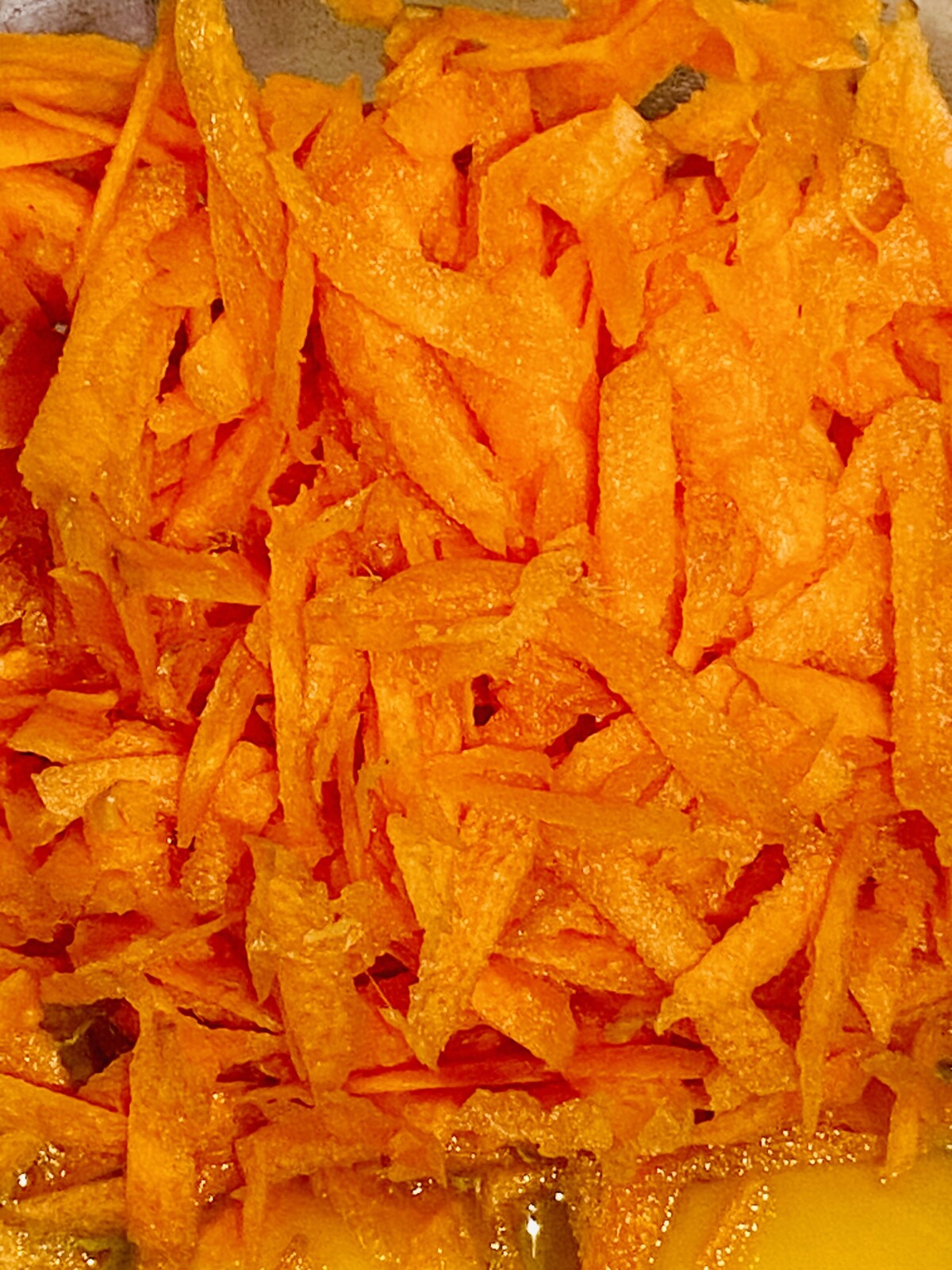 a dish of grated carrot