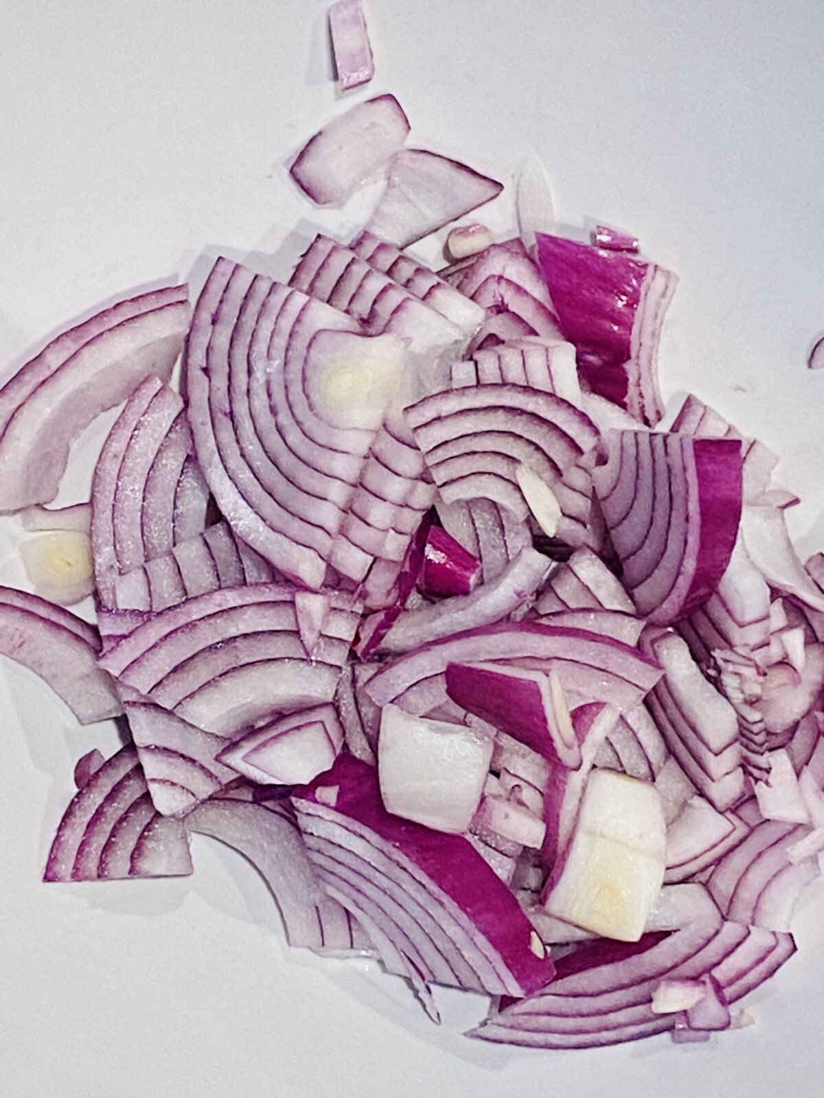 a dish of red onions, sliced