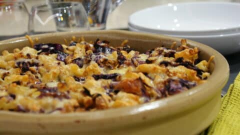 cabbage, sultana and nut pasta bake in a ceramic dish