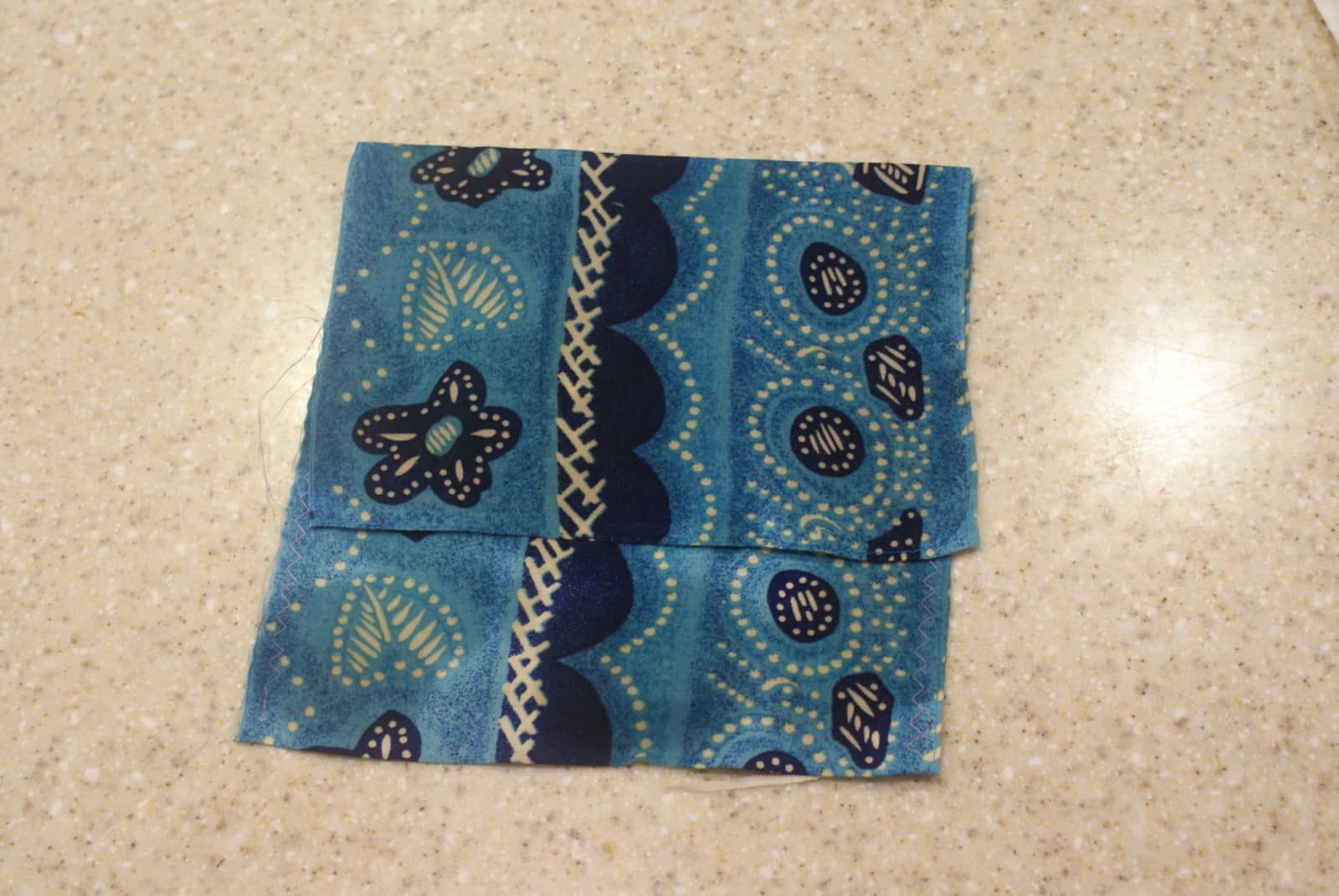 a beeswax sandwich bag, in a blue patterned fabric. 