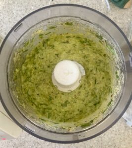 wild garlic pesto after being blitzed, in a food processor bowl