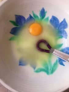egg yolk oil and sugar in a bowl