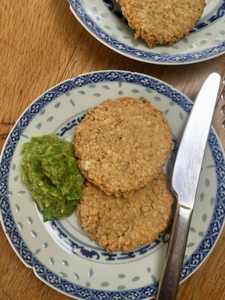 peaut oatcakes - on a plate close up with onion and peas