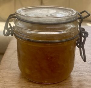 a small kilner pot of onion jam with the lid clipped closed.