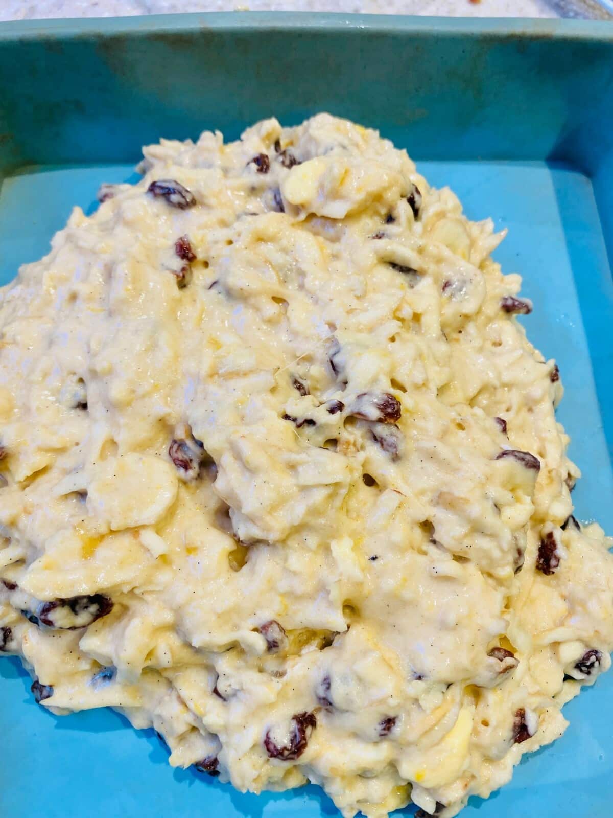 parsnip cake - raw mixture in a blue silicone baking tin