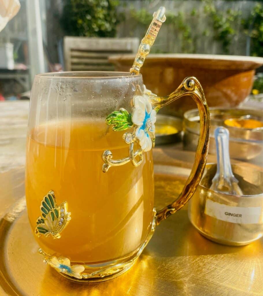 dried ginger tea in a decorative glass mug