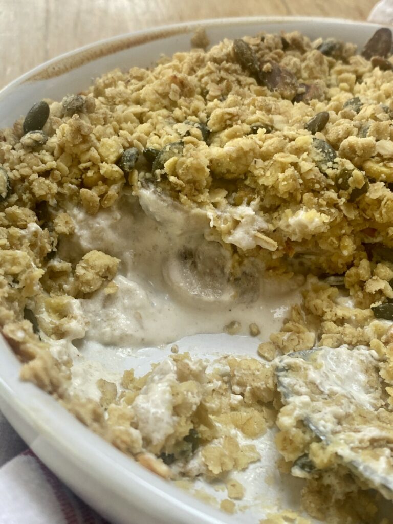 chicken and mushroom crumble in a white dish.