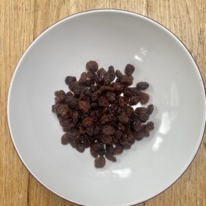 raisins in a white bowl.
