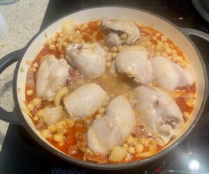 chicken thighs and chickpeas cooked until the chicken releases its liquid.