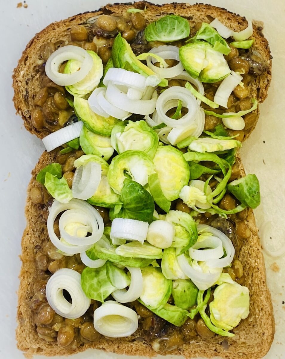 the filling of a lentil sandwich before the other slice is put on top. 