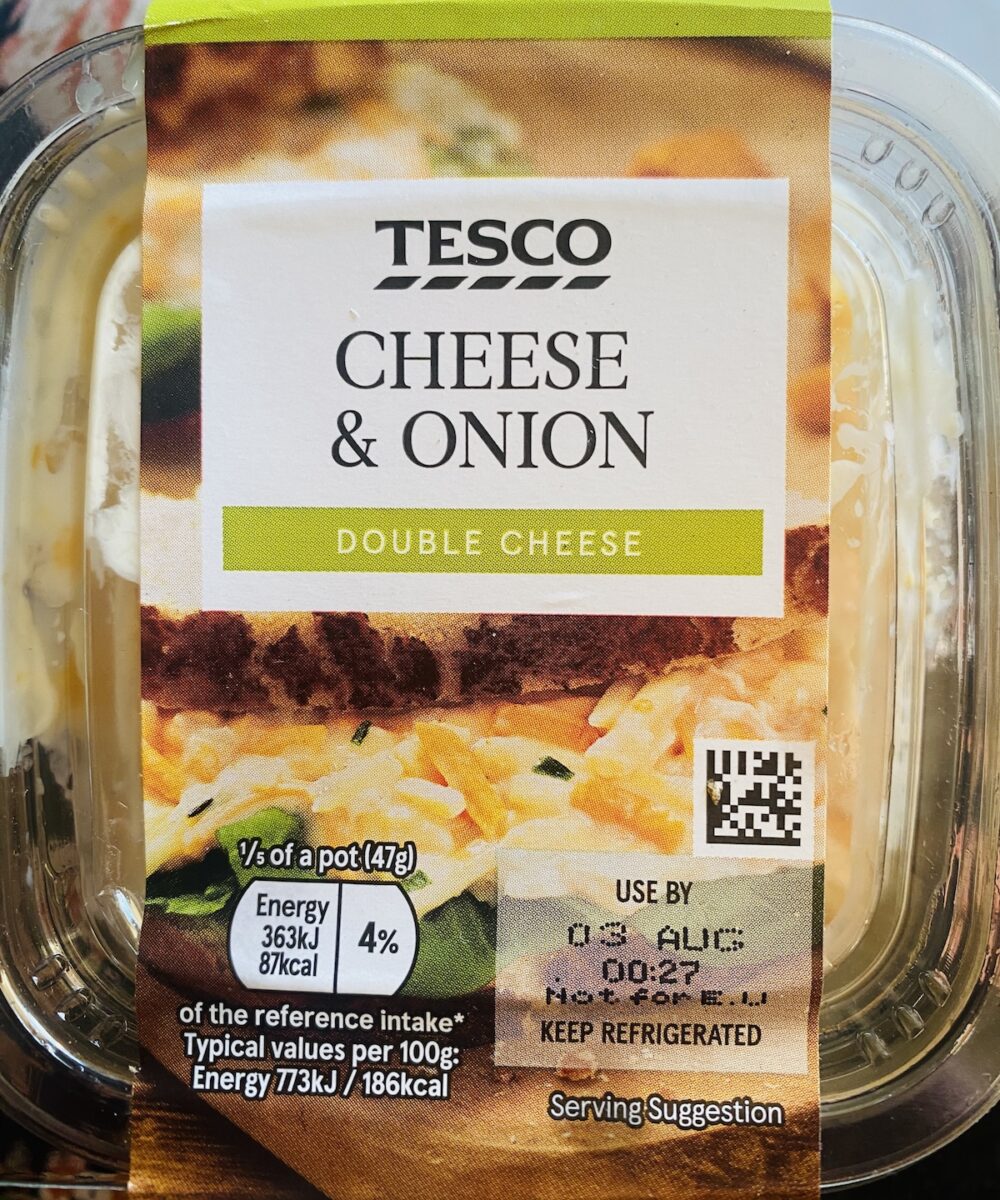 front of a pot of supermarket cheese and onion sandwich filling.