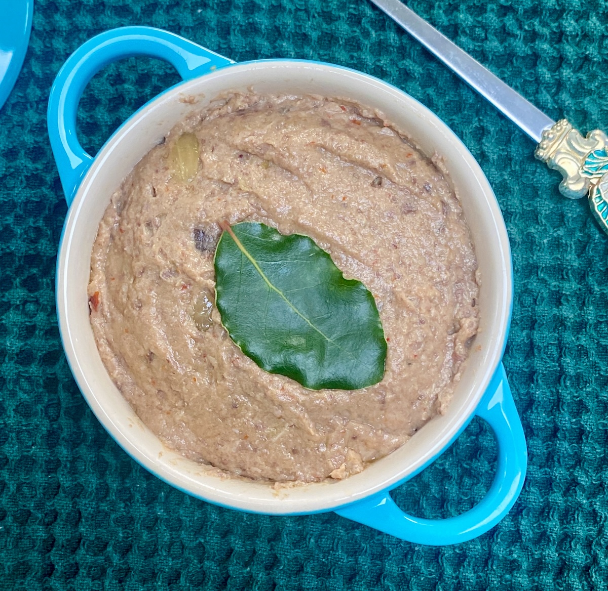 turkey liver poate on a 250ml pale blue dish, with a bay leaf on top. 