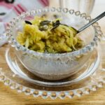 apple chia seed pudding. The topping is a small grated apple, a few pumpkin seeds and a trickle of maple syrup.