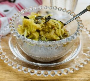 apple chia seed pudding. The topping is a small grated apple, a few pumpkin seeds and a trickle of maple syrup.